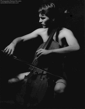 A black and white image of a naked slender man playing the cello